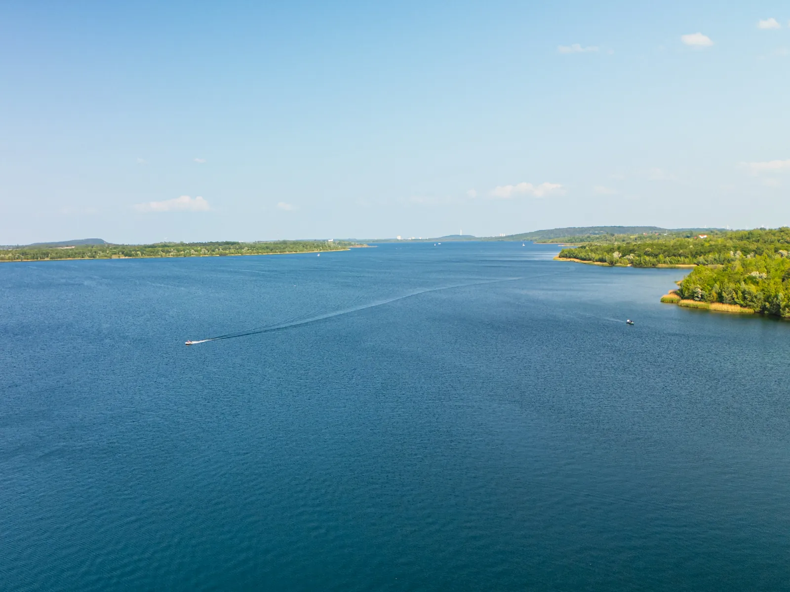 Wide view over Lake Geiseltalsee with boats