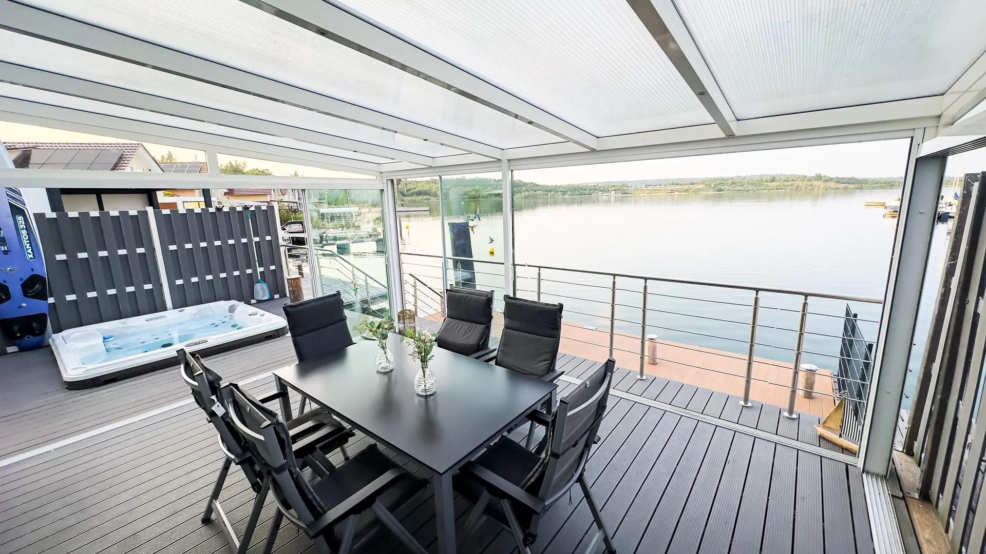 Conservatory with a dining table for six and a view over Lake Geiseltalsee